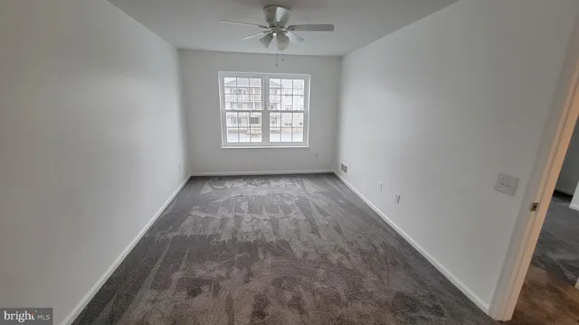 a bathroom with a double vanity sink toilet and a mirror