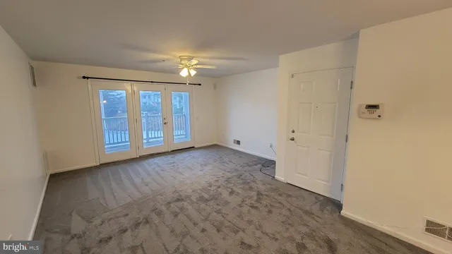 a view of an empty room with a fireplace