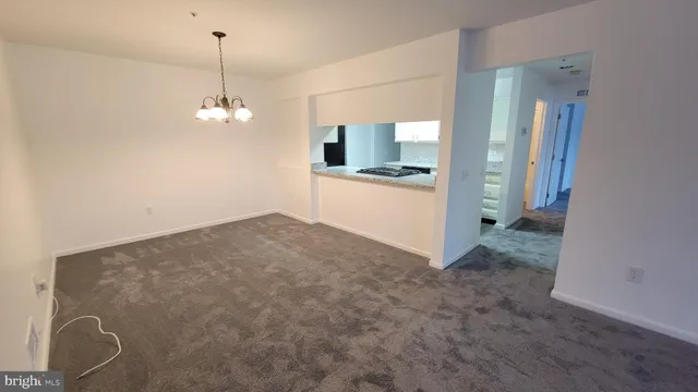 a view of a kitchen with a sink and cabinets