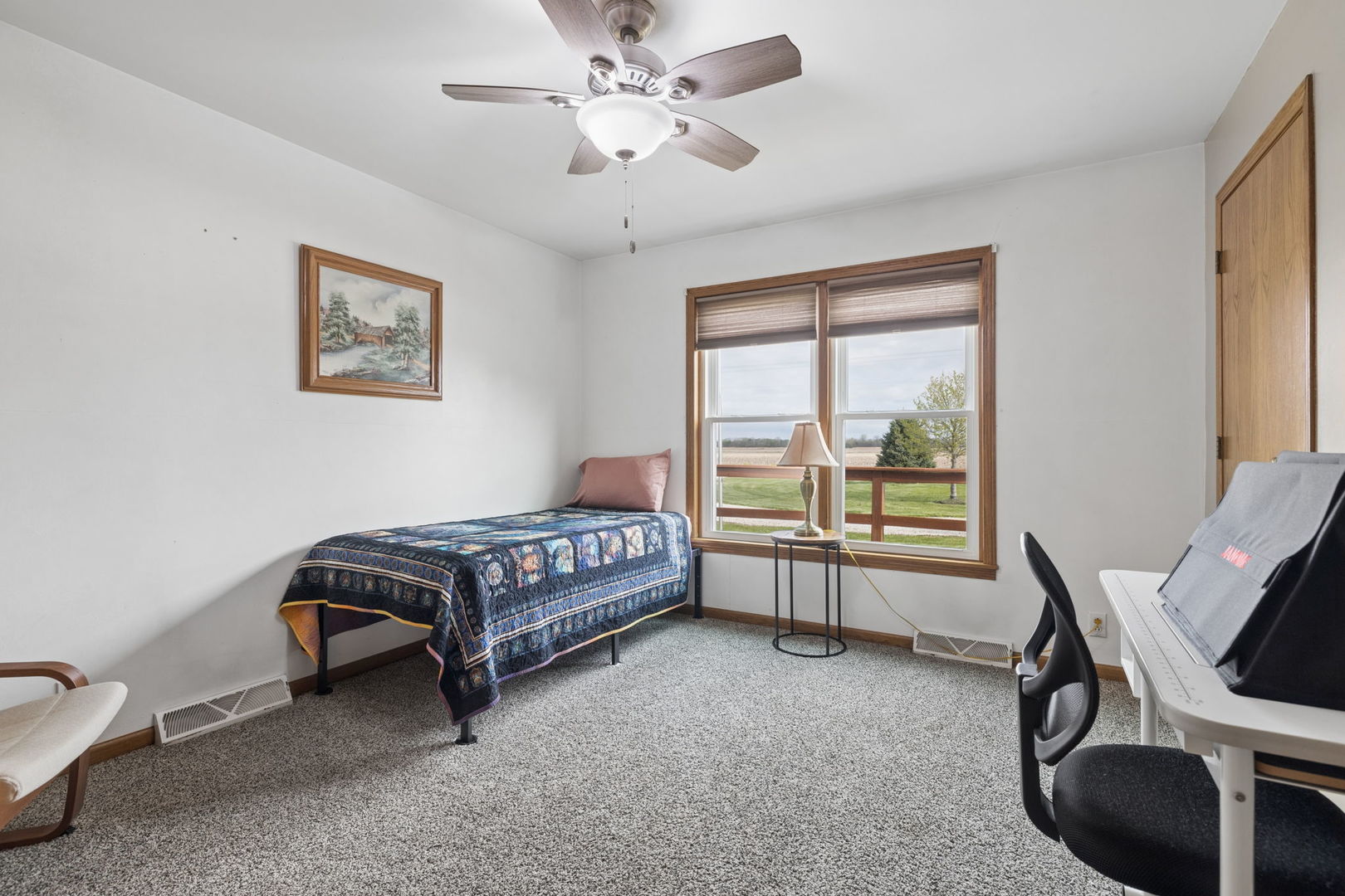 15334 West 3000N Road Essex, IL 60935 - Photo 17 of 42 a bedroom with a bed and a desk