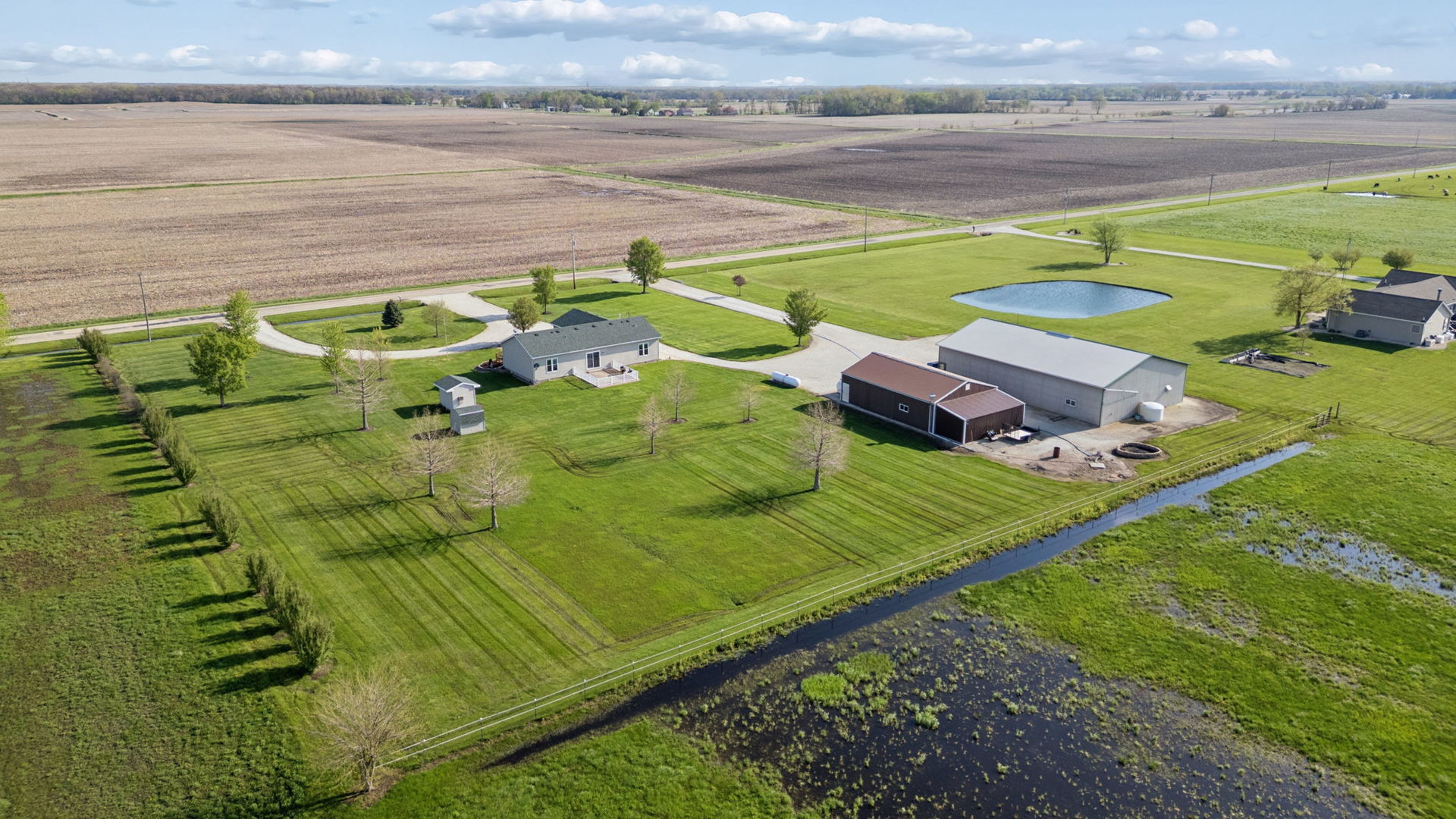 15334 West 3000N Road Essex, IL 60935 - Photo 24 of 42 a view of a tennis ground with a large pool