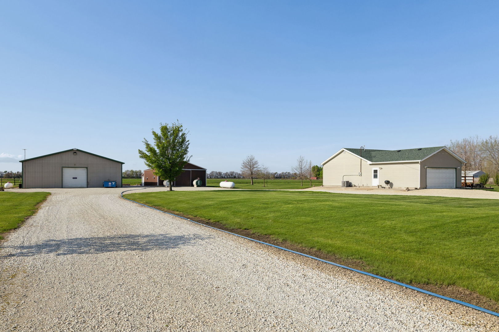15334 West 3000N Road Essex, IL 60935 - Photo 26 of 42 a front view of a house with garden