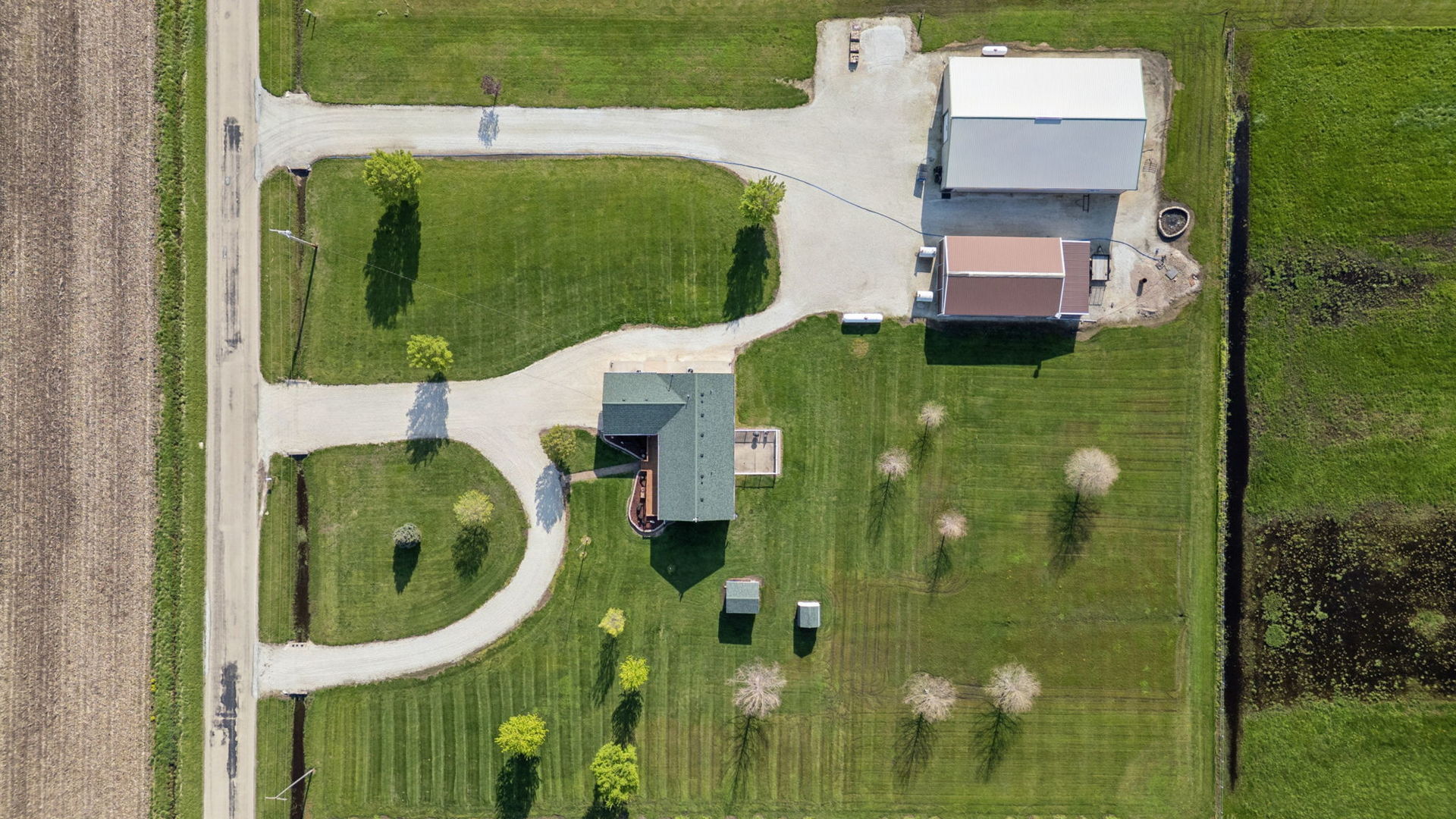 15334 West 3000N Road Essex, IL 60935 - Photo 3 of 42 an aerial view of a residential houses with outdoor space and swimming pool