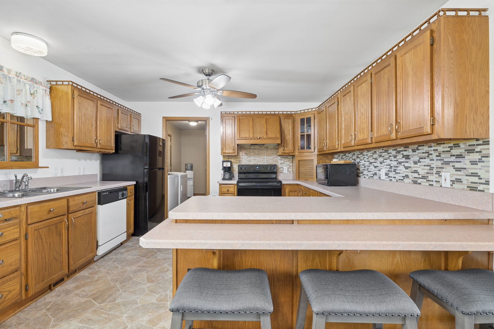 15334 West 3000N Road Essex, IL 60935 - Photo 6 of 42 a kitchen with stainless steel appliances granite countertop a sink refrigerator and microwave