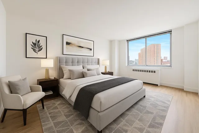 a spacious bedroom with a bed and a couch