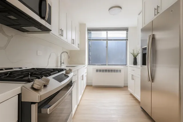 a kitchen with a stove and a refrigerator
