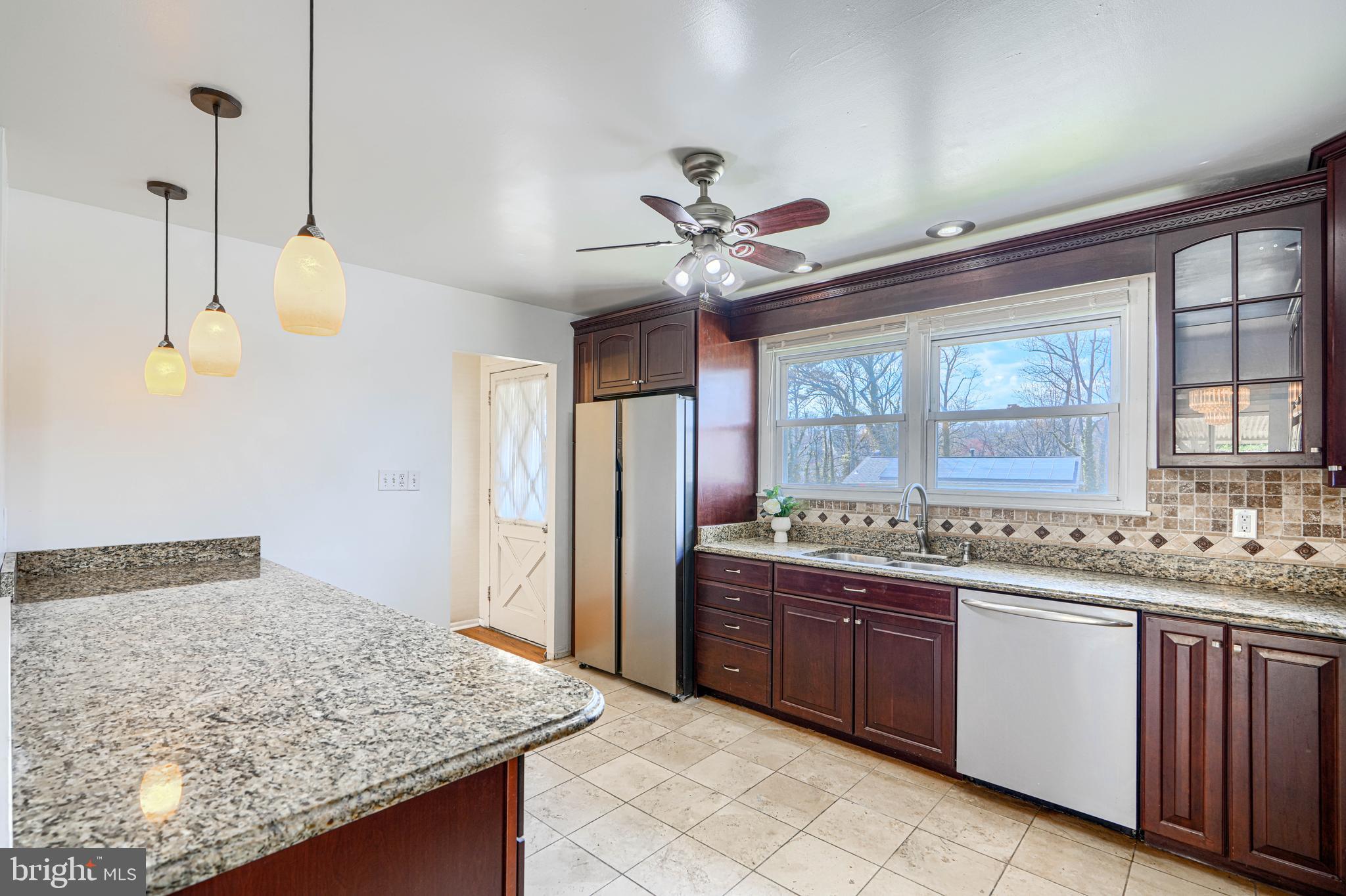 1741 Ellinwood Road Rosedale, MD 21237 - Photo 14 of 43 a kitchen with a sink a counter space and a window