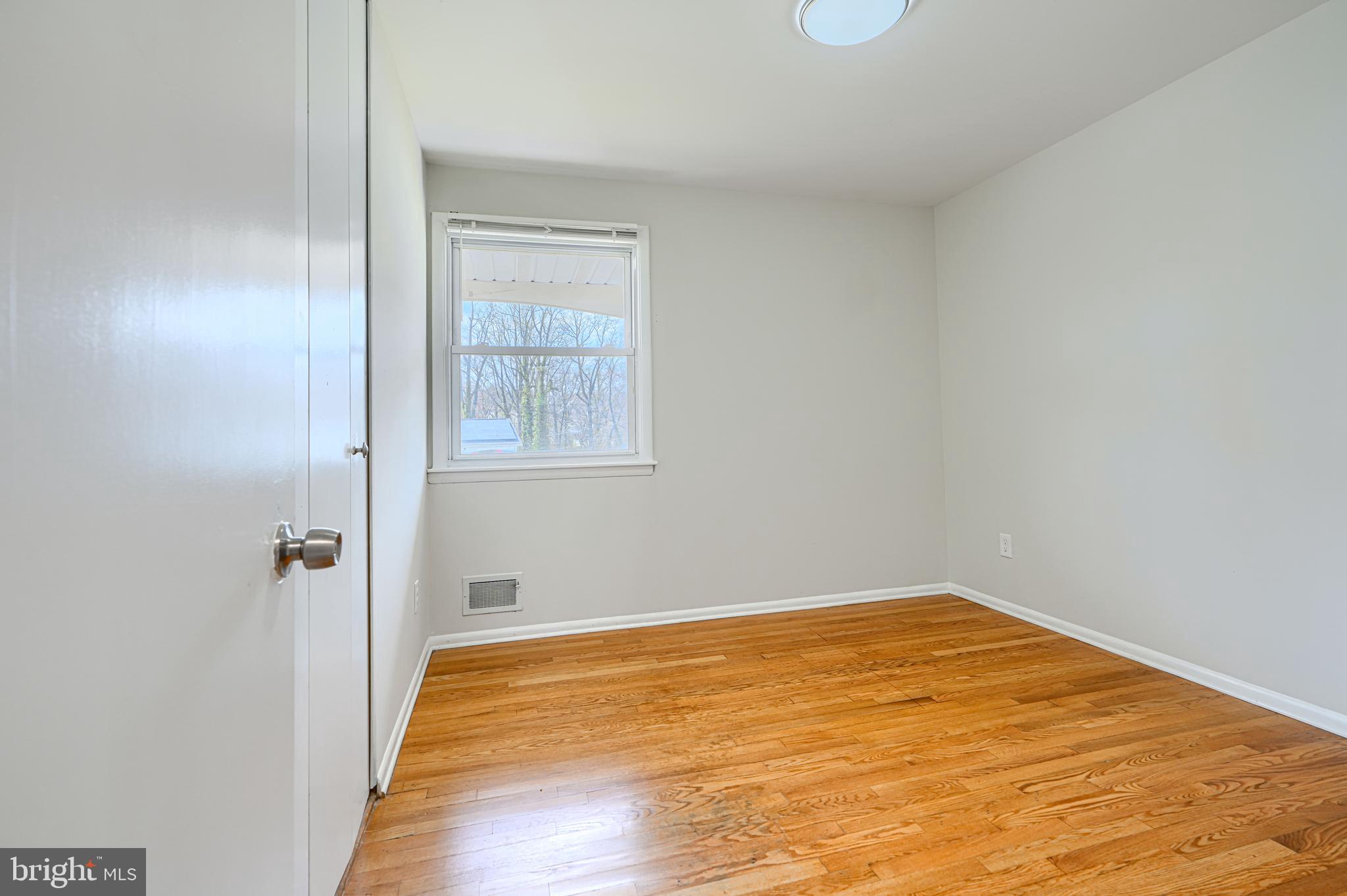 1741 Ellinwood Road Rosedale, MD 21237 - Photo 22 of 43 a view of a room with wooden floor and a window