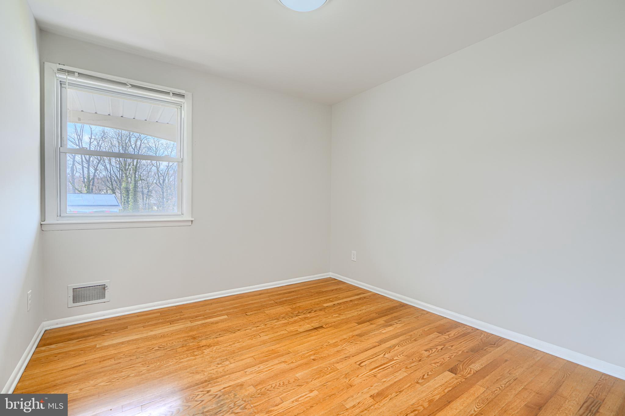 1741 Ellinwood Road Rosedale, MD 21237 - Photo 23 of 43 a view of empty room with wooden floor