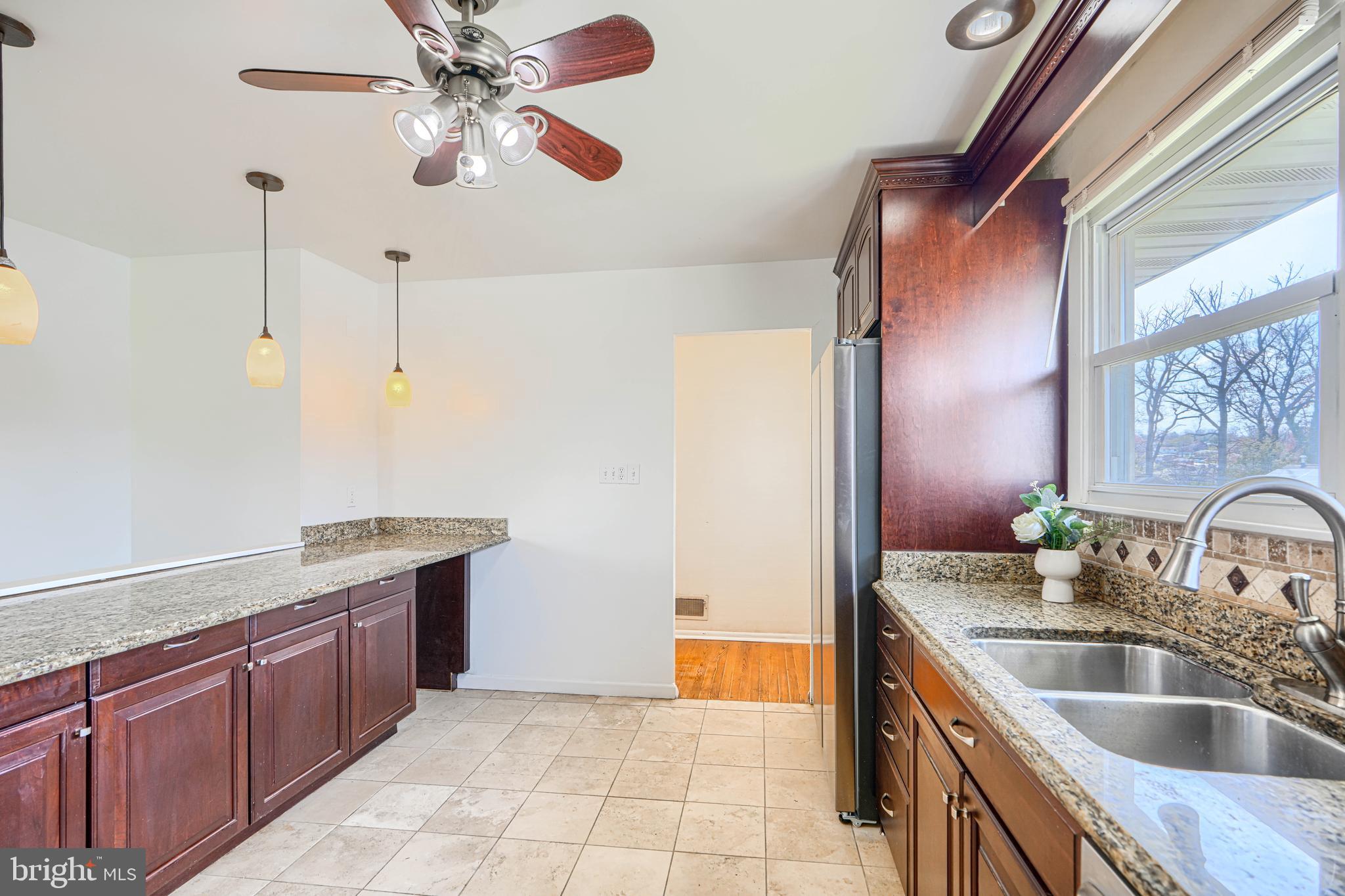 1741 Ellinwood Road Rosedale, MD 21237 - Photo 8 of 43 a kitchen with stainless steel appliances granite countertop a sink and dishwasher