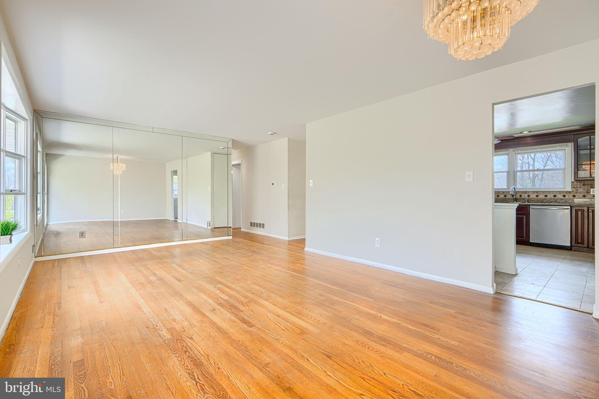 1741 Ellinwood Road Rosedale, MD 21237 - Photo 10 of 43 an empty room with wooden floor and windows