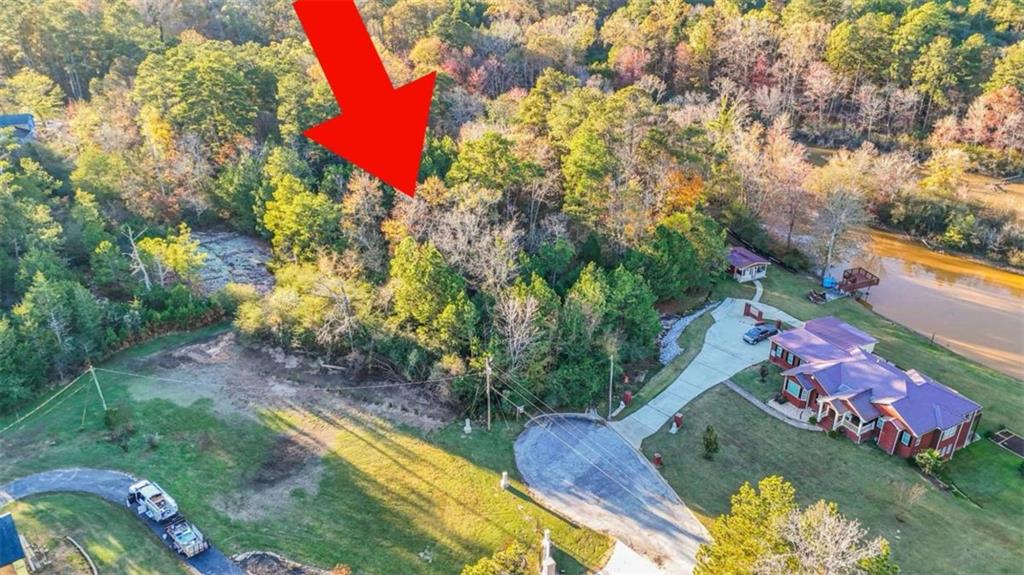 Capri Northwest Capri Cove Conyers, GA 30012 - Photo 2 of 9 an aerial view of a house with a yard and tennis court