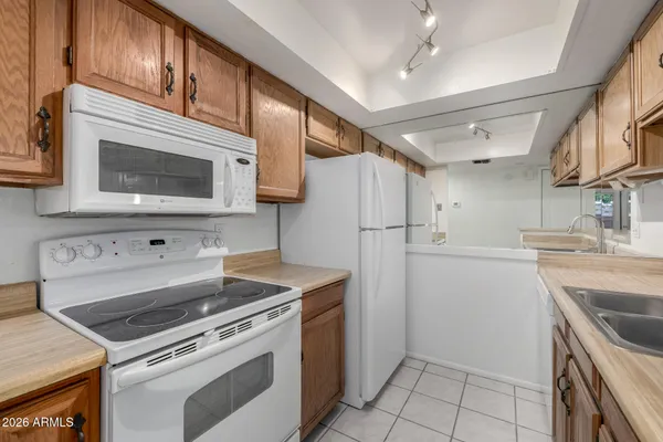 a kitchen with a stove microwave and refrigerator