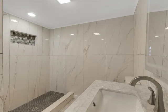 a bathroom with a shower and a shower