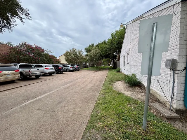 a view of street with parked cars