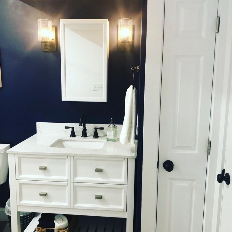 1 Park Road, Unit 1 Sandwich, MA 02644 - Photo 19 of 25 a bathroom with a sink and a mirror