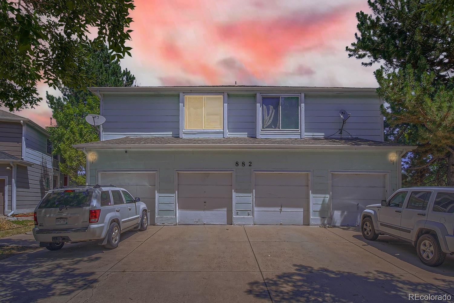 882 South Uravan Court Aurora, CO 80017 - Photo 1 of 33 a front view of a house with parking space