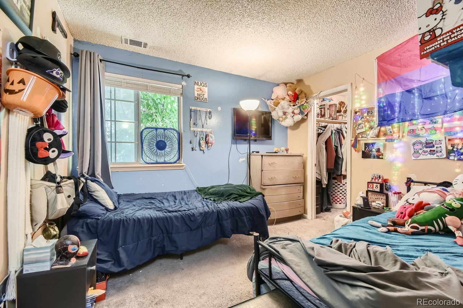 882 South Uravan Court Aurora, CO 80017 - Photo 12 of 33 a living room with furniture and a window