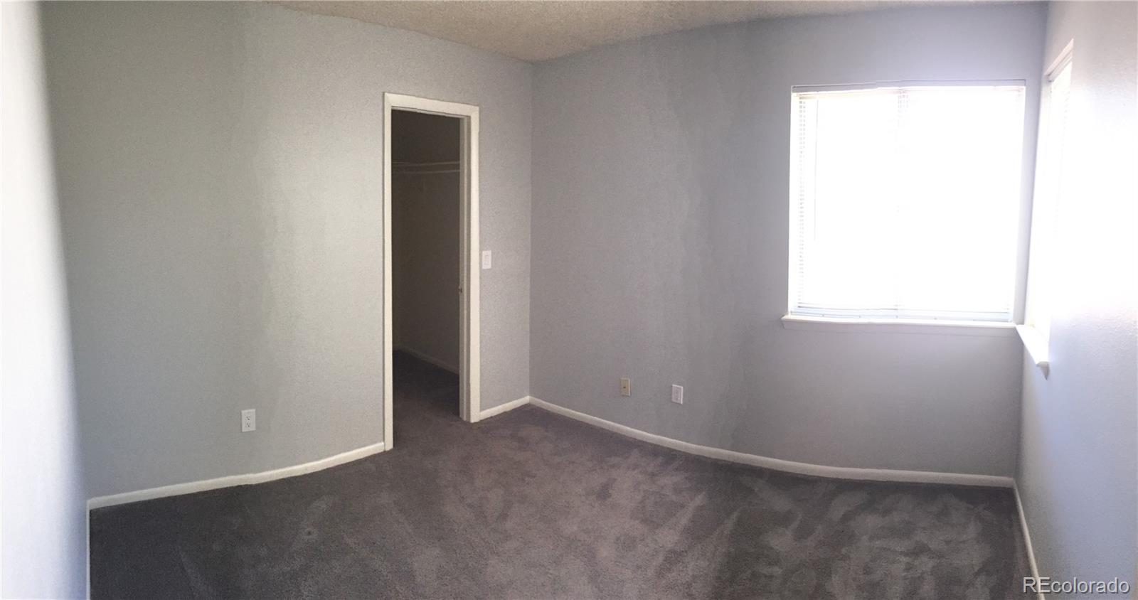 882 South Uravan Court Aurora, CO 80017 - Photo 25 of 33 an empty room with windows