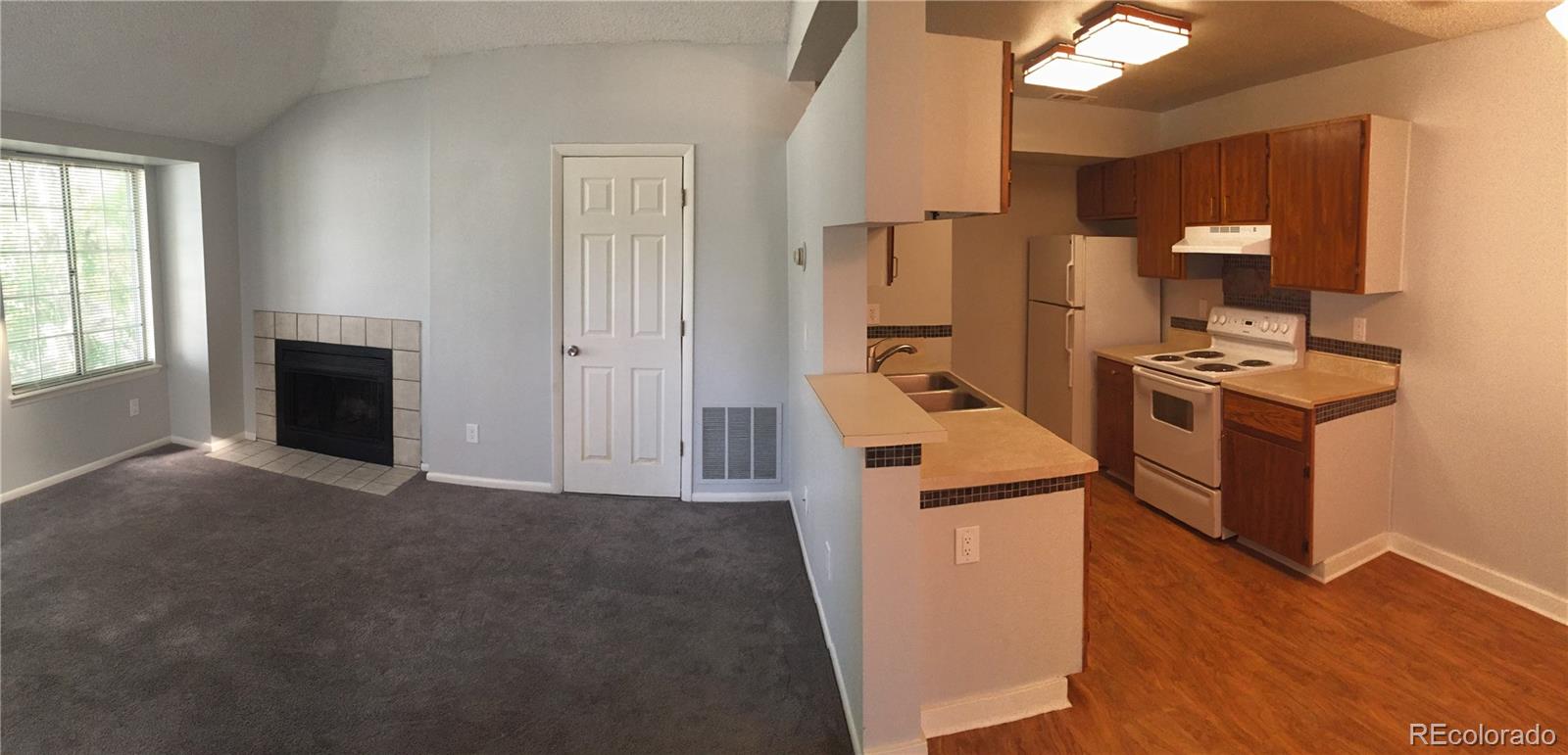 882 South Uravan Court Aurora, CO 80017 - Photo 27 of 33 a kitchen with a refrigerator a stove top oven a sink and dishwasher