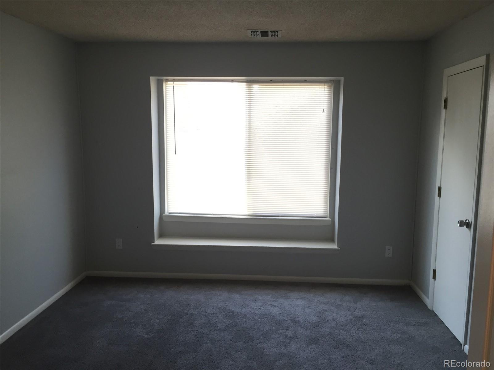 882 South Uravan Court Aurora, CO 80017 - Photo 29 of 33 an empty room with a window