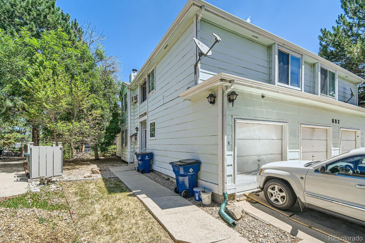 882 South Uravan Court Aurora, CO 80017 - Photo 32 of 33 a view of a car parked in front of a house