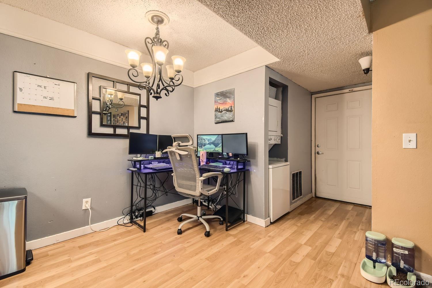 882 South Uravan Court Aurora, CO 80017 - Photo 6 of 33 a view of a workspace with furniture and a window