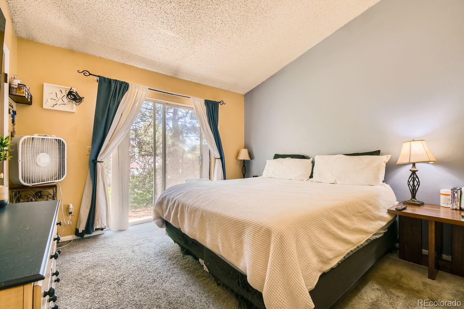 882 South Uravan Court Aurora, CO 80017 - Photo 9 of 33 a bedroom with a bed and a window