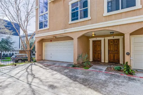 a front view of a house with garage