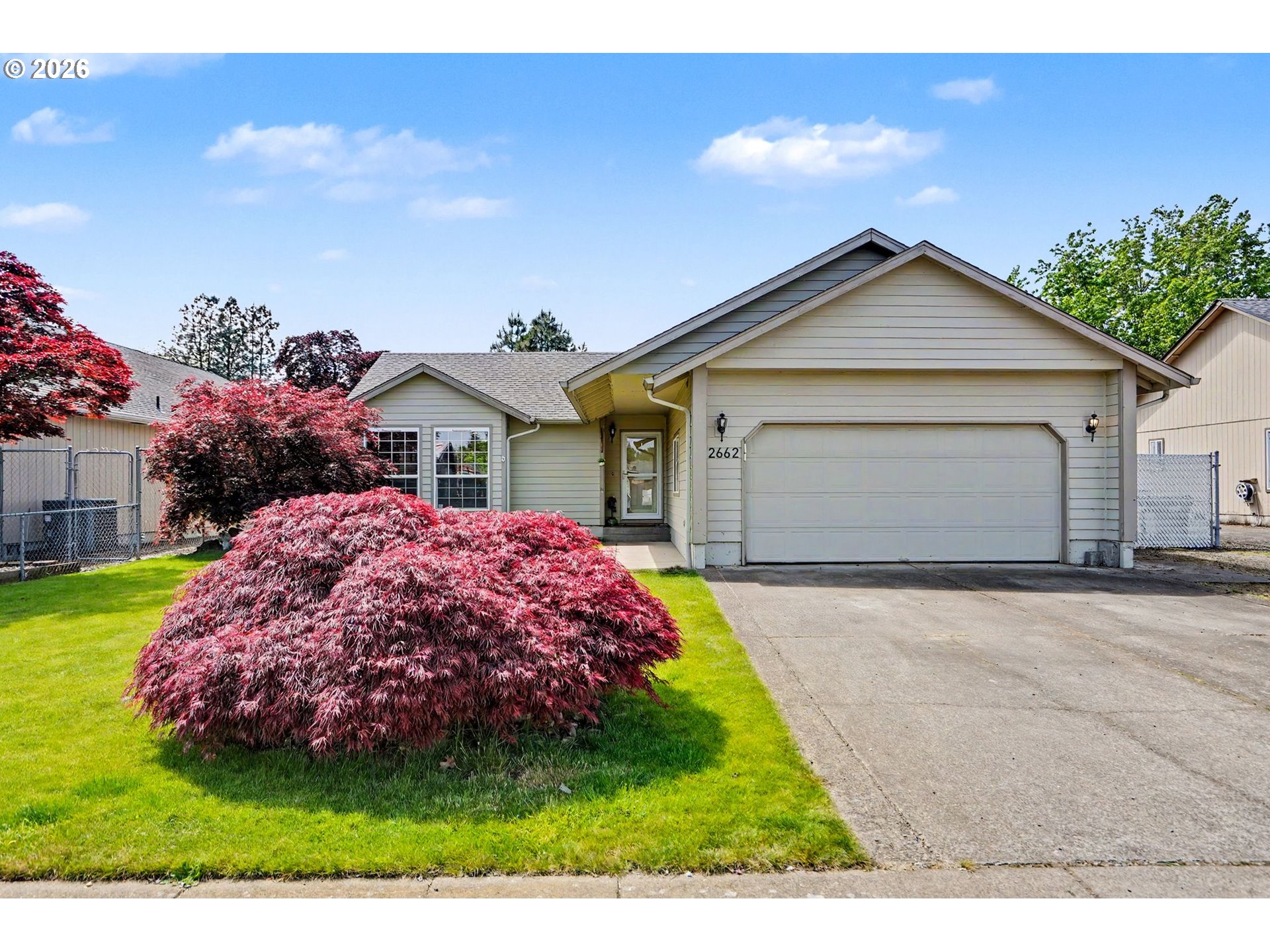 2662 South 12th Street Lebanon, OR 97355 - Photo 1 of 38 a front view of a house with a yard and garage