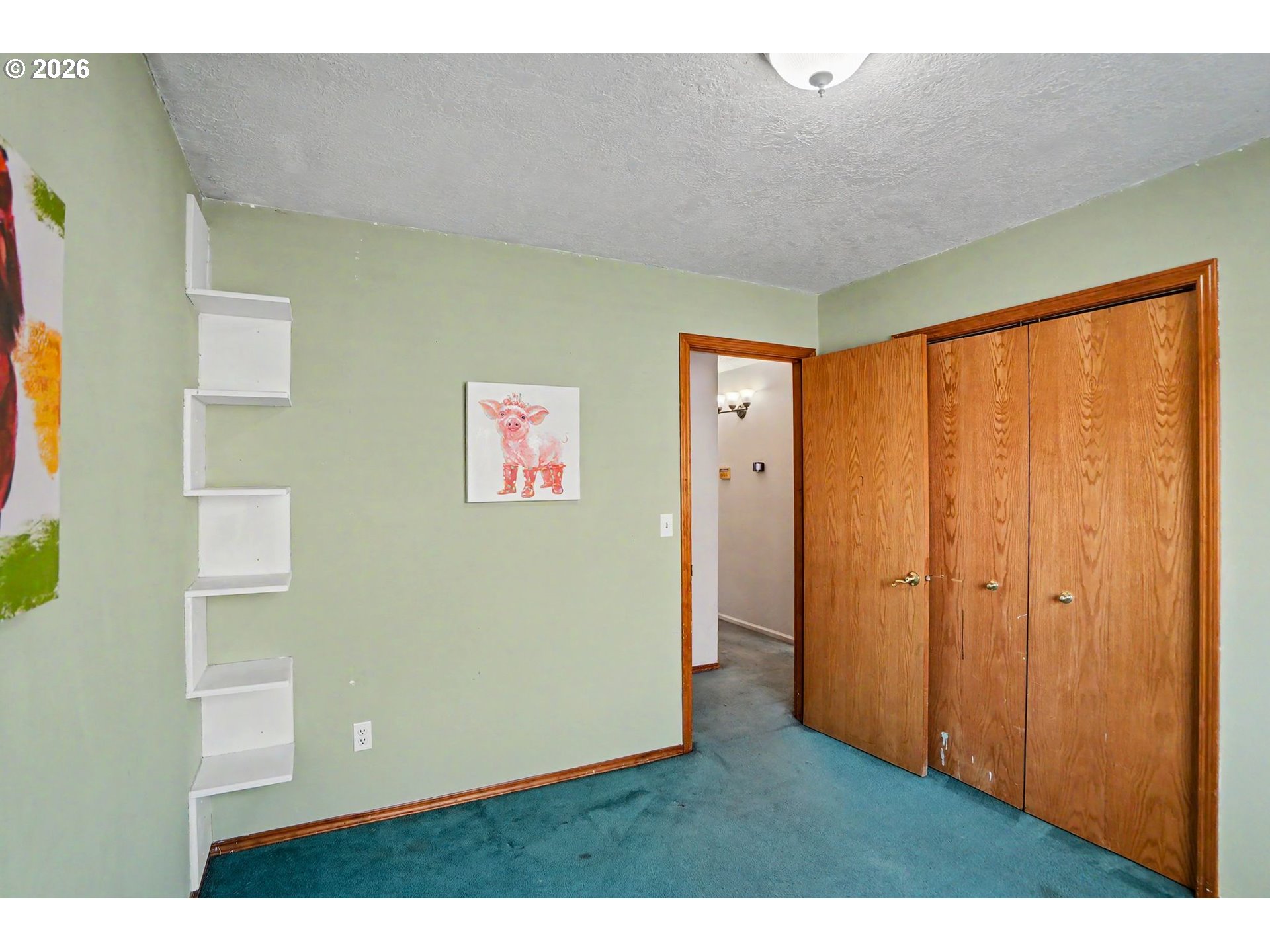 2662 South 12th Street Lebanon, OR 97355 - Photo 19 of 38 a view of an empty room with wooden floor