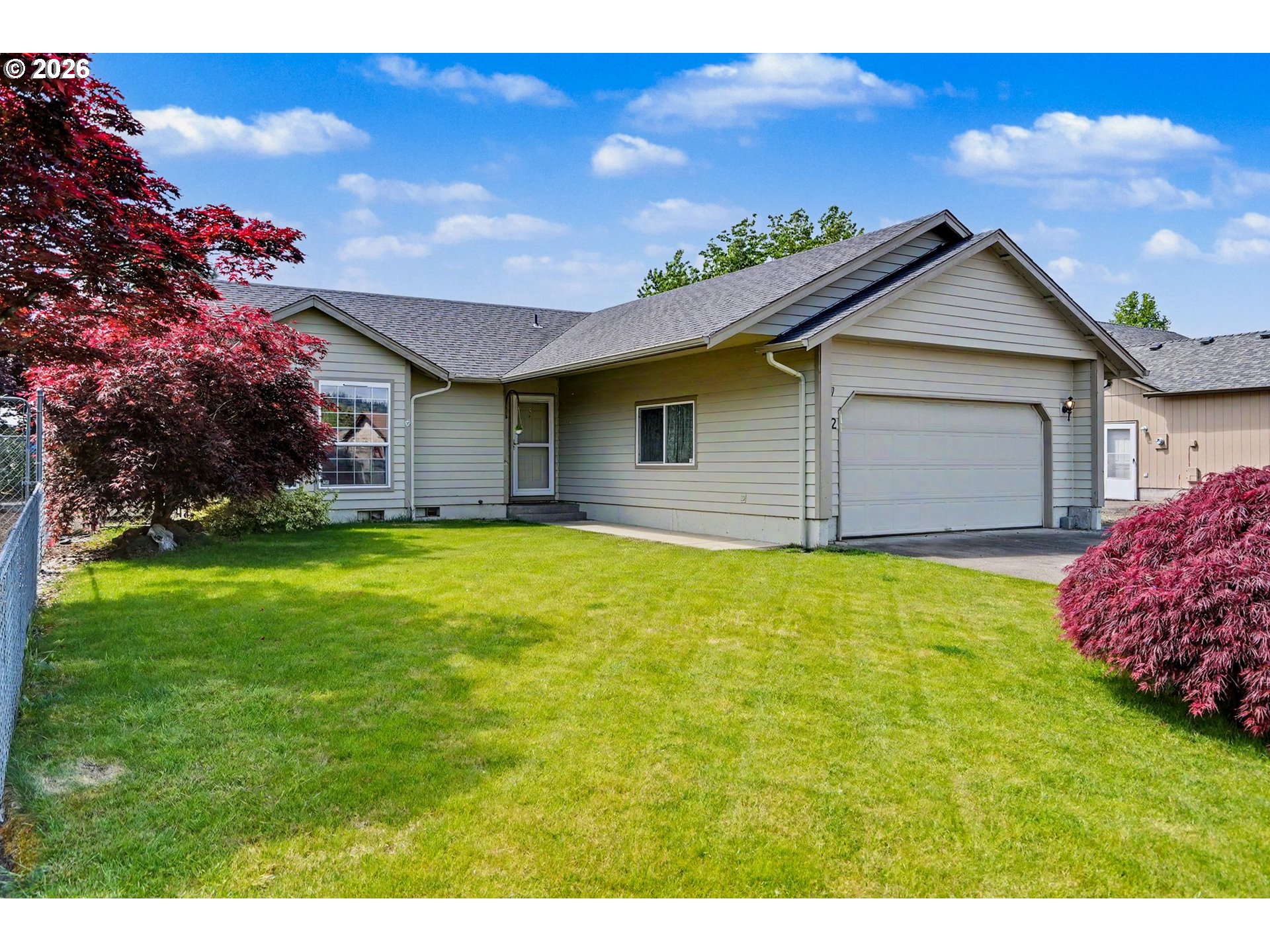 2662 South 12th Street Lebanon, OR 97355 - Photo 2 of 38 a front view of a house with garden