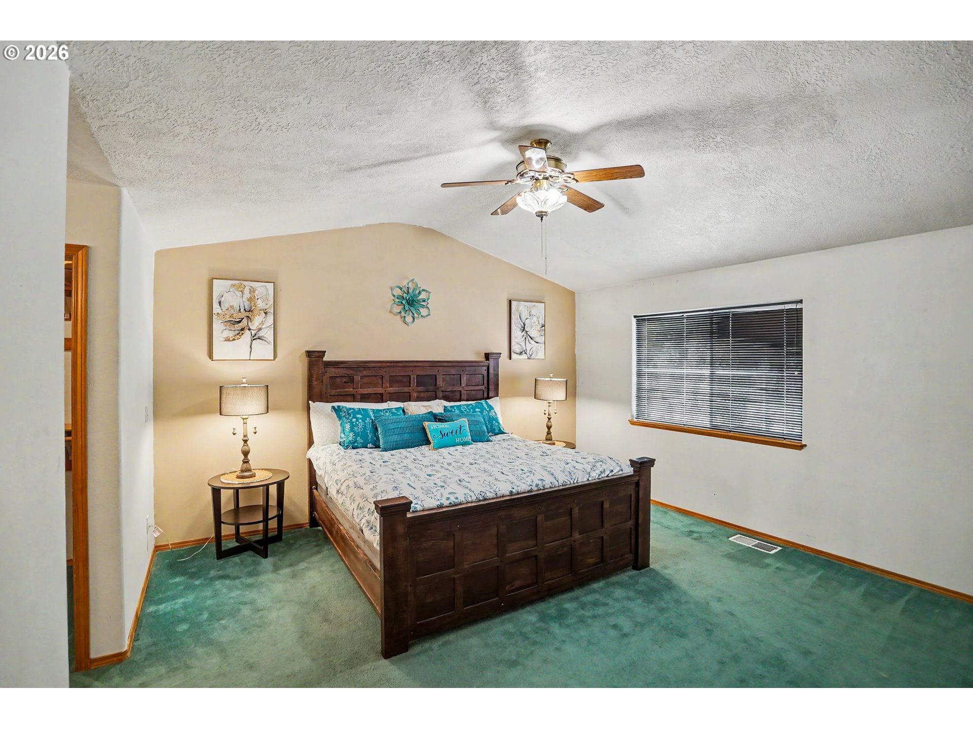 2662 South 12th Street Lebanon, OR 97355 - Photo 23 of 38 a bedroom with a bed and a chandelier