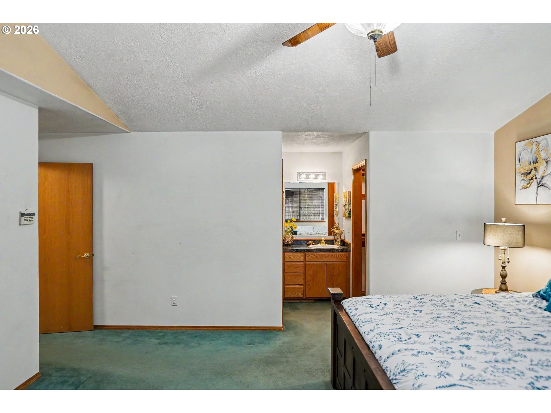 2662 South 12th Street Lebanon, OR 97355 - Photo 25 of 38 a bedroom with a bed and a cabinets