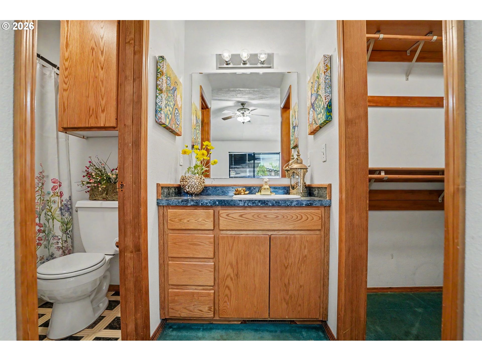 2662 South 12th Street Lebanon, OR 97355 - Photo 27 of 38 a bathroom with a sink a toilet and a mirror