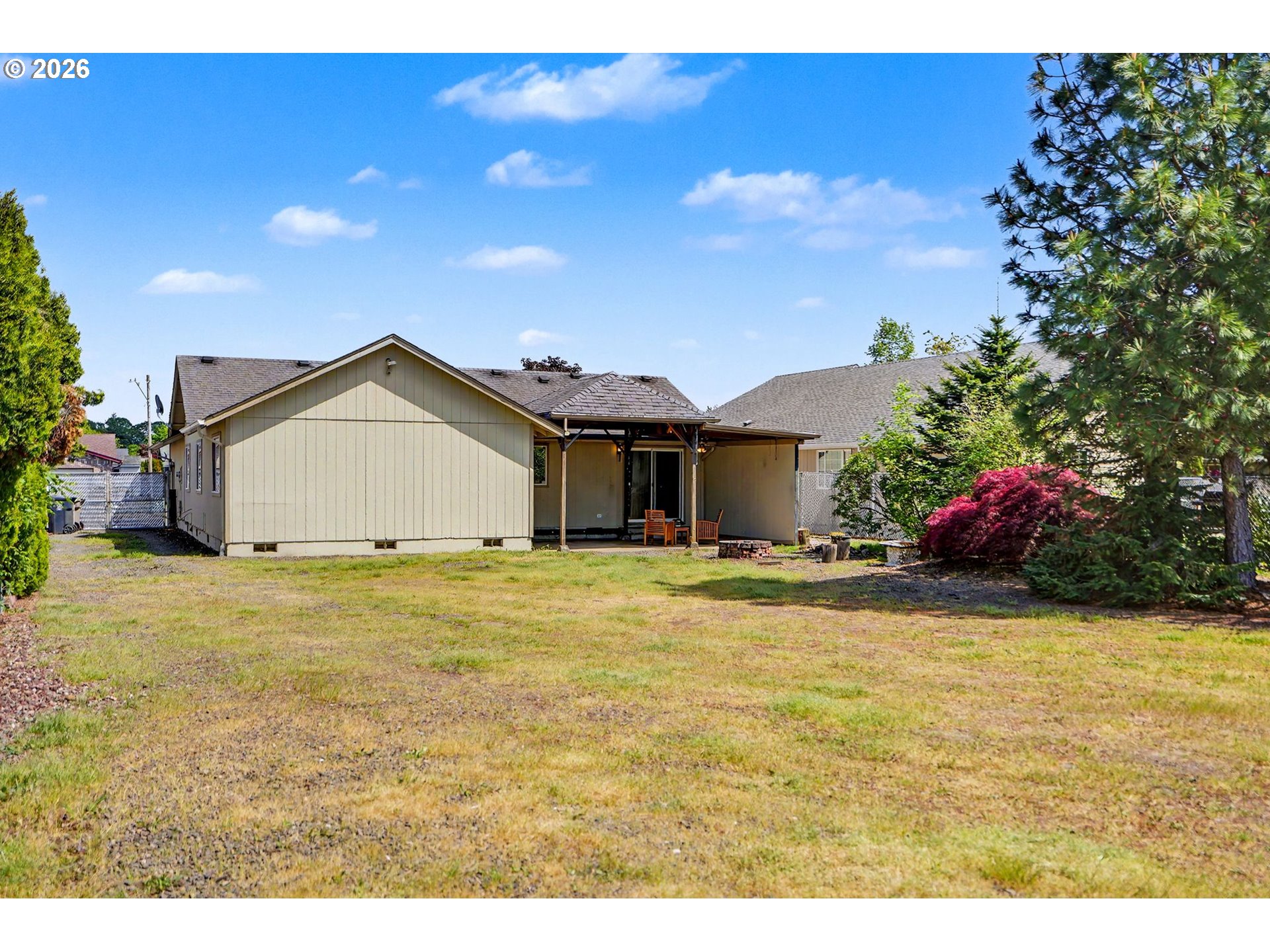 2662 South 12th Street Lebanon, OR 97355 - Photo 36 of 38 a view of an house with backyard and entertaining space
