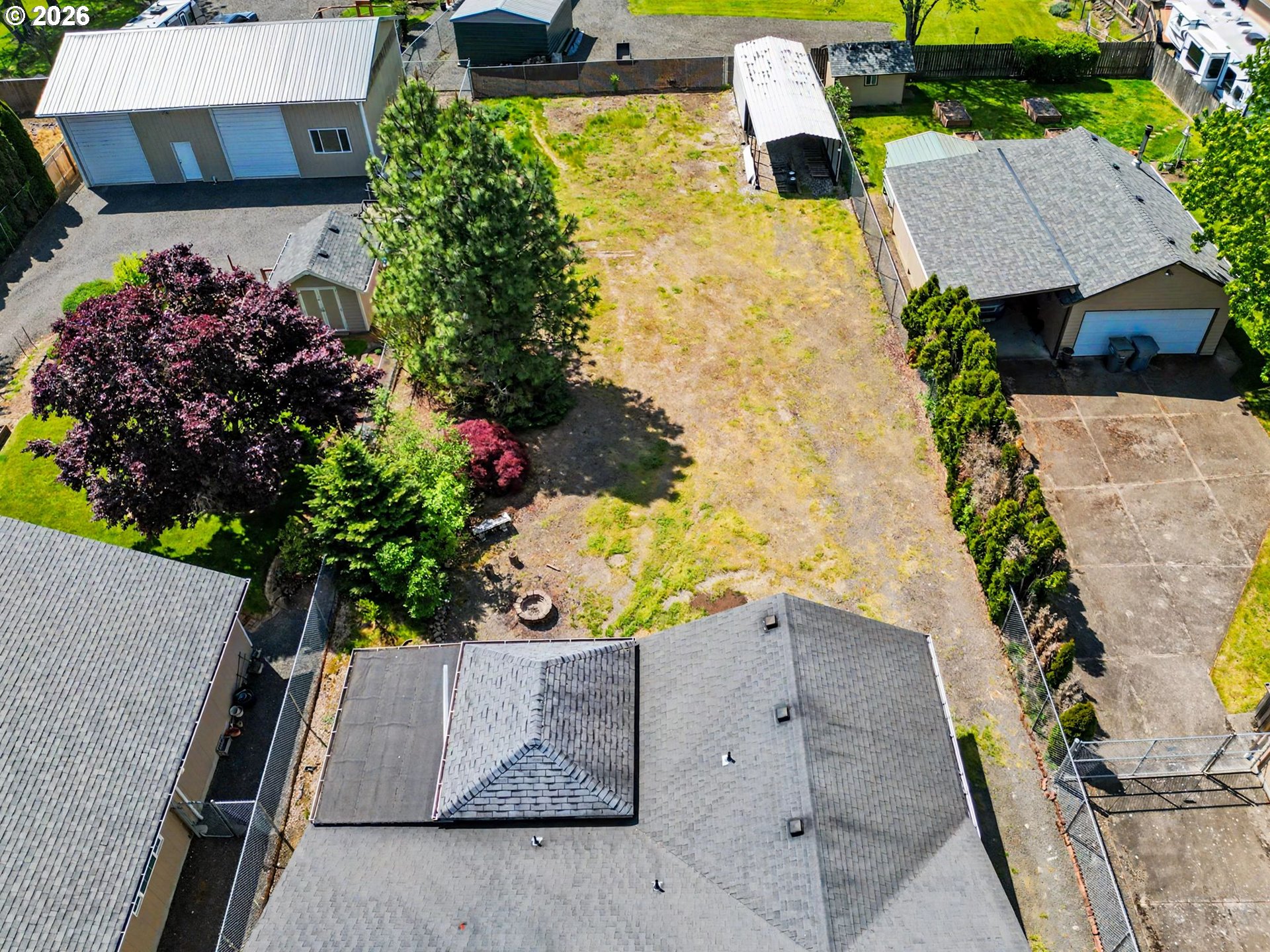 2662 South 12th Street Lebanon, OR 97355 - Photo 37 of 38 an aerial view of a house with a yard and garden