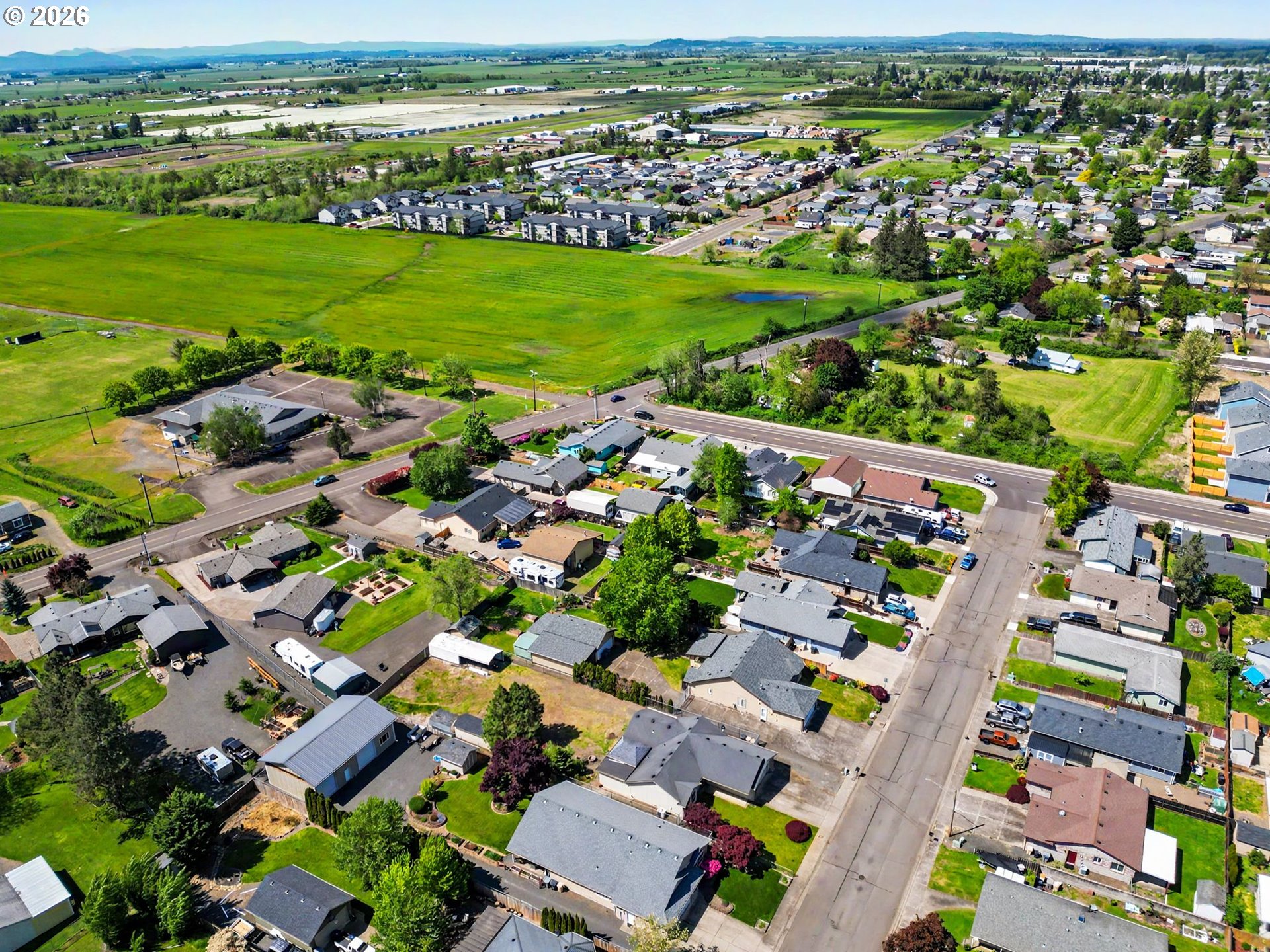 2662 South 12th Street Lebanon, OR 97355 - Photo 38 of 38 an aerial view of a city with lots of residential buildings ocean and mountain view in back
