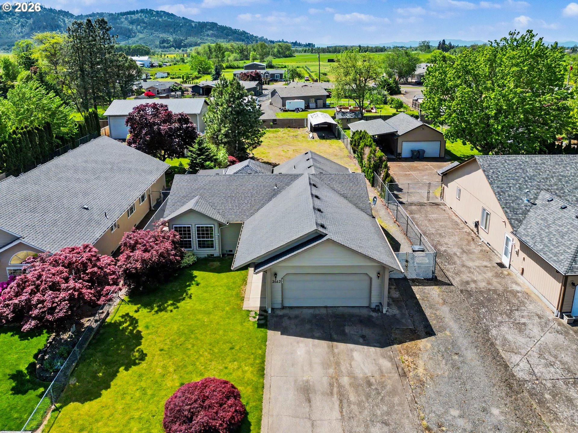 2662 South 12th Street Lebanon, OR 97355 - Photo 4 of 38 an aerial view of a house with a garden