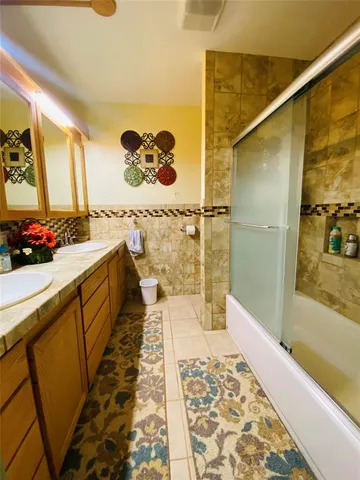 a bathroom with a sink and mirror