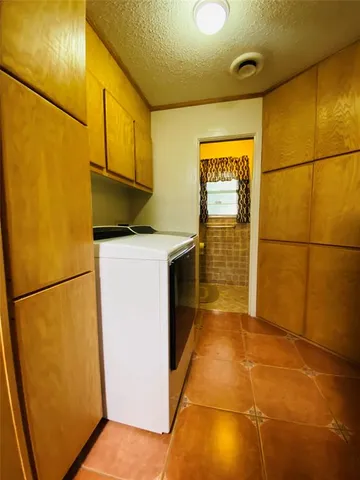 a bathroom with a granite countertop window