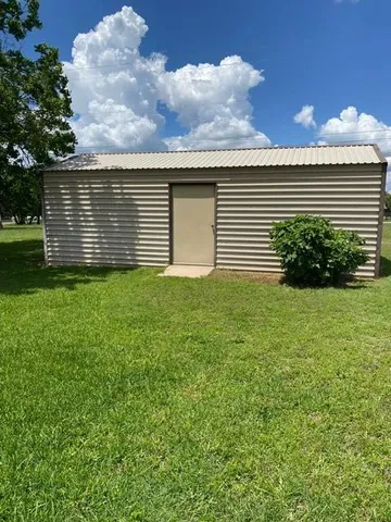 a backyard of a house with lots of green space
