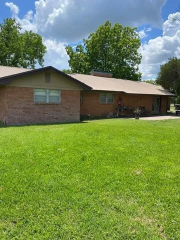 a backyard of a house with lots of green space