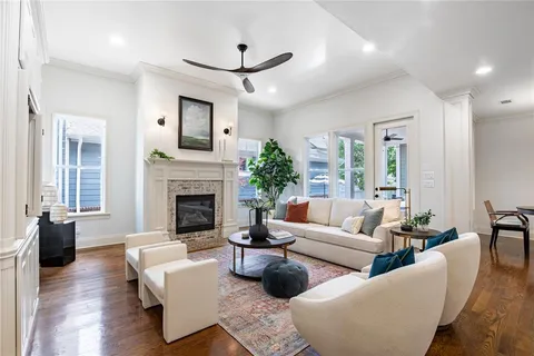a living room with furniture and a fireplace