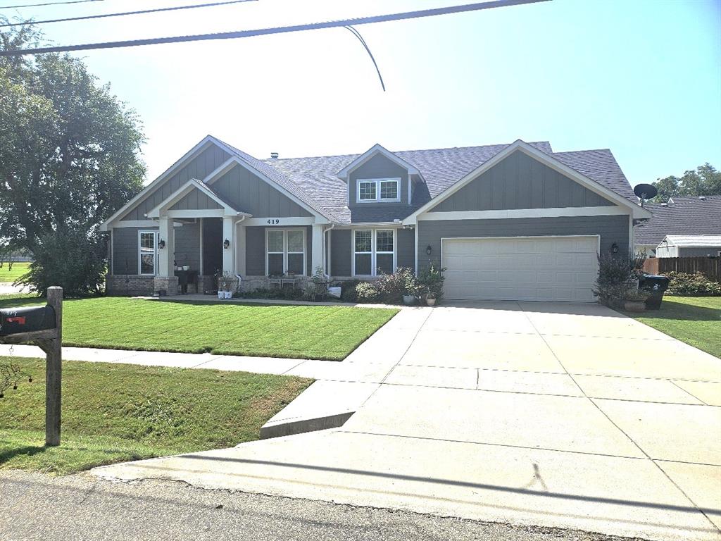 419 East Main Street Pilot Point, TX 76258 - Photo 1 of 1 a front view of a house with a yard
