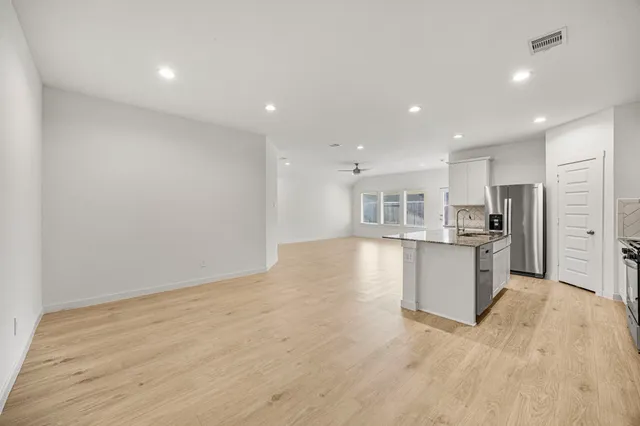 a view of kitchen with wooden floor