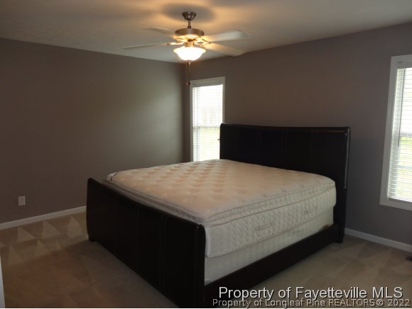 5432 Arnette Road Hope Mills, NC 28348 - Photo 11 of 25 a bedroom with a bed and a window