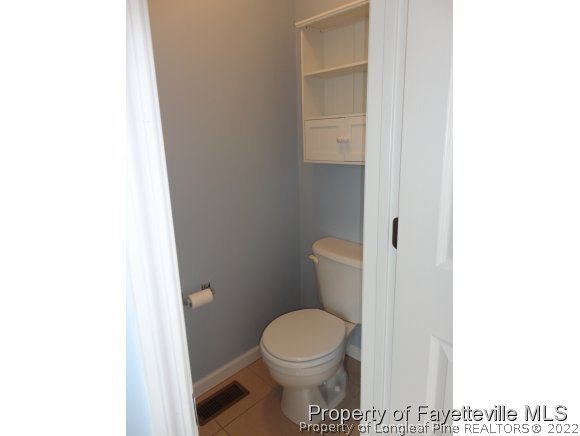 5432 Arnette Road Hope Mills, NC 28348 - Photo 14 of 25 a white toilet sitting next to a white sink