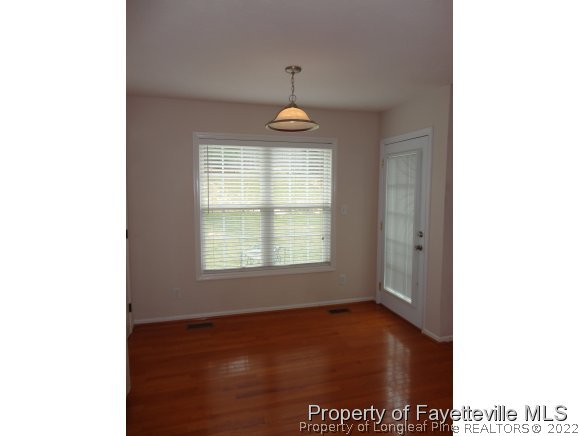 5432 Arnette Road Hope Mills, NC 28348 - Photo 9 of 25 a view of a livingroom with a window and wooden floor