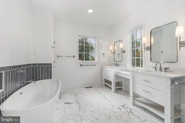a bathroom with a shower sink and mirror